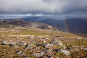 Rainbow over a Scottish alpine landscape